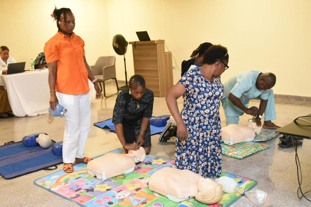 Healthcare professionals practising chest compressions on training mannequins during BLS and ACLS training at the 2025 Abia Global Medical Mission.
